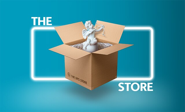 A white statue of Cupid in The UPS Store box